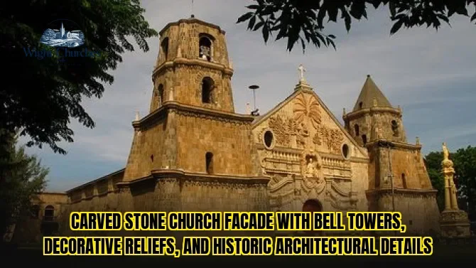 Carved stone church facade with bell towers, decorative reliefs, and historic architectural details